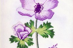Embroidery of a violet flower.