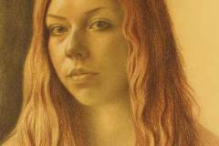 Portrait of a red haired young woman.