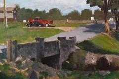 1 – Acrylic painting by J Bowers of a concrete brdge with a red truck in the background.