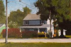 4 – Acrylic painting by J Bowers of an older small town white house with the sun hitting its roof.