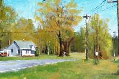 6 – Acrylic painting by J Bowers of a lone white country house with electric lines viewed from across the road.
