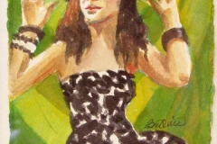 Woman in brown polka dot dress with her hands held up, possibly dancing.