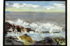 Black bordered seascape with waves crashing against ricks under a bright cloudy sky.