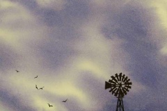 Sprawling purple gray cloudy sky looming over a farmers wooden windmill.