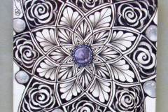 52 - black lines drawing of a round flower with a center purple jewel and pearls on the edges