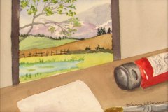 15, An artist's table with a red tube of paint and a brush in front of a window view of a green field under purple mountains.