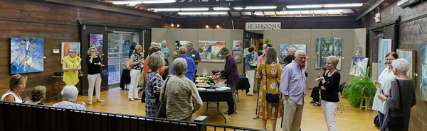 People attending the reception for artist Anne Harkeness exhibit