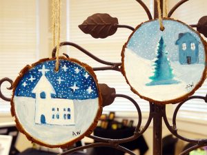 circular tree bark rimmed ornaments by artist Allegra Nicole