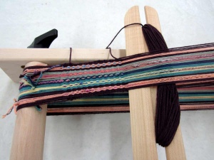 Inkle loom up close with thread.