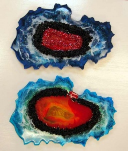 Abstract oyster-like glass sculptures by Jacqueline Dunford.