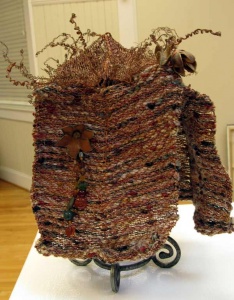 Fiber and wire sculptural headwear by Sue Helmken.