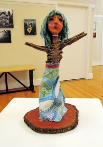 twig, yarn, and fabric female figure sculpture by artist Crystal Whitesides.