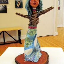 twig, yarn, and fabric female figure sculpture by artist Crystal Whitesides.