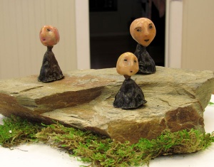 decorated plant pod figure sculptures by artist Crystal Whitesides.