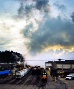 Rail yard under late afternoon skies photographed in color by photographer Robert Webb.