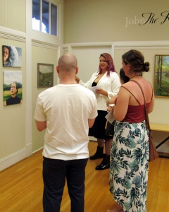 Artist Amelia Lenke and friends admire SASi's A Fresh Look exhibit.