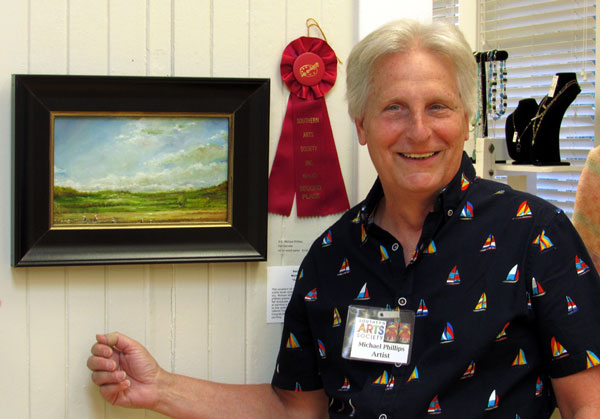Artist Michael Phillips wins second place for his oil painting “Fall Harvest”.