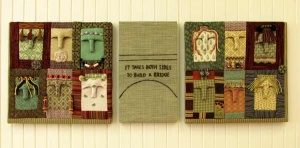 Patchwork fabric panel with faces by artist Anna Dlougolendaia.