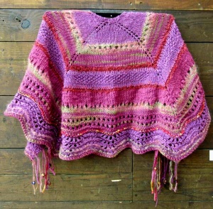 Knitted pink and magenta striped shawl with fringe by artist Chris Dunlap.