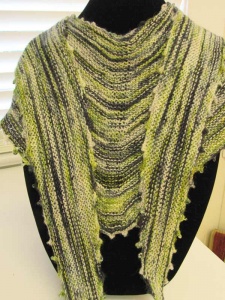 Green and black woven shawl with dagged fringe by artist Gail Boyles.