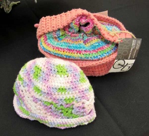 Multi-colored knitted cap and lunch pail by artist Gail Boyles.