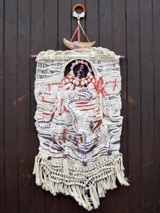 Knitted banner topped by a ship by artist Randy Leibowitz Dean.