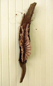 Woven lichen on aged wood sculpture by artist Sue Helmken.