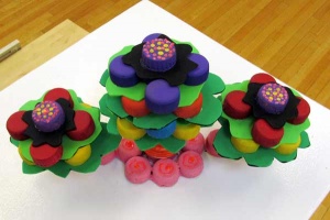 73a bright plastic flower soft sculptures.