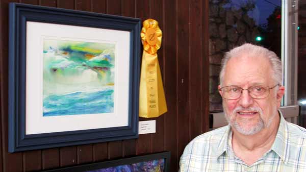 Artist Ron Shepard in front of his third place artwork at Southern Arts Society's Nature Reconsidered 2021 art exhibit.