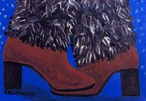 Two suede boots with furry tops.
