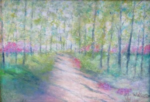 Wooded path through trees and magenta flowering bushes.