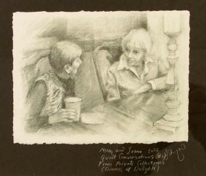 Two woman at a table talking engagedly while enjoying coffee.