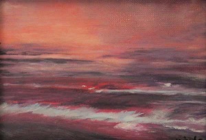 Rose sunset on waves hitting shoreline.