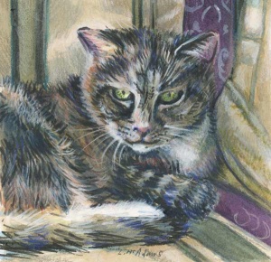 Tabby cat resting on a striped pillow.
