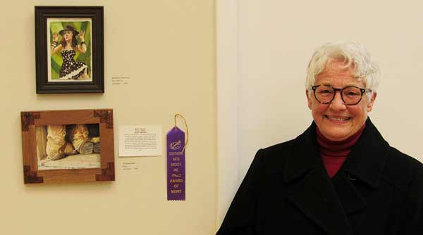Artist Shelby Sabelli with her merit award winning work.