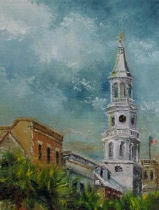 White church spire against a blue gray sky viewed over palmetto tree tops.