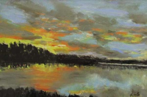 Colorful sunset reflected in a dark Rankin Lake.