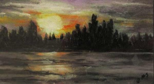 Last effects of the sun behind pine trees reflected in a dark Rankin Lake.