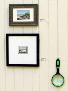 Ronald Shepard work installed with magnifying glass for viewing.