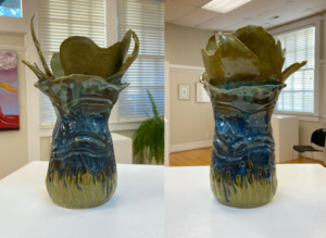 two views of green and blue ceramic sculpture with leaf shapes at the top opening.