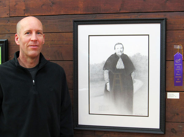 Merit award winner Kenny Walker with his graphite drawing Proverbs 31 Woman.