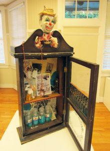 Assembled sculpture of an antique medicine cabinet and pill jars.