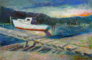 A red and white boat at dockside.
