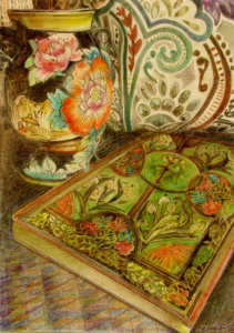 An ornate covered book beside patterned oriental vases.