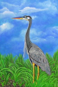 large crane with intricate patterned wings in a green grassy field against a bright blue sky.