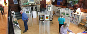 View looking down on the Fireside Galley displaying the Trail photography exhibit
