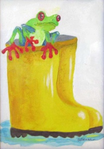 a red eyed tree frog inside a pair of yellow rain boots.