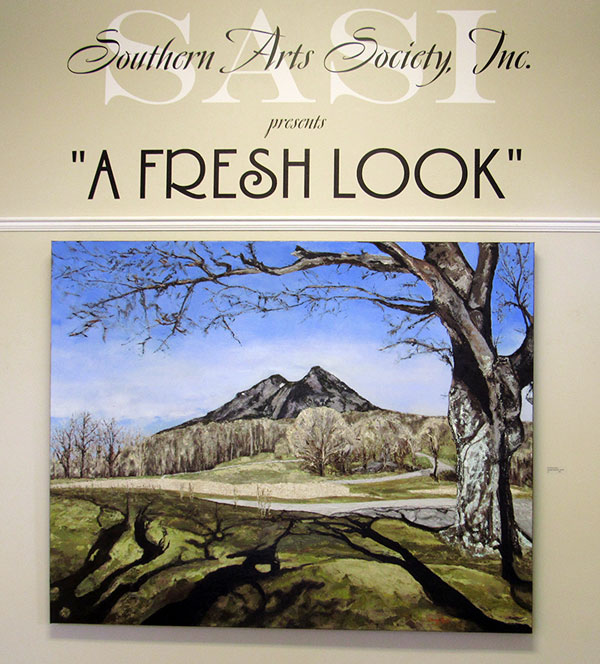 entance to art exhbit A Fresh Look featuring a winter scene of Grandfather Mountain painted in oil by artist Timmy Hord.