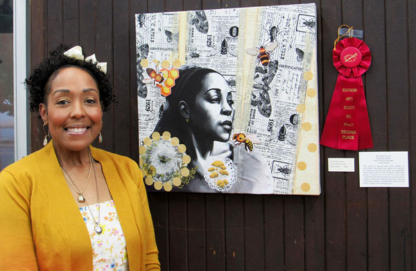 Artist Denisha Sweat with her collage showing a woman and flowers Maong pasted newspaper clippings.