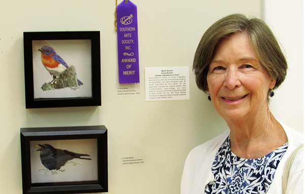 Janet Baxter with her thread artwork Eastern Bluebird on Post